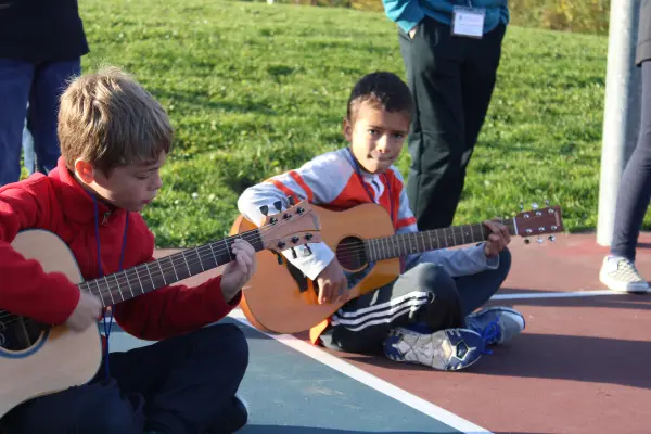 Students playing guitar